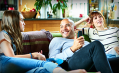Three people sitting in a comfortable environment
