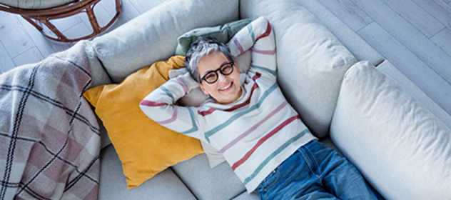 Woman laying on couch