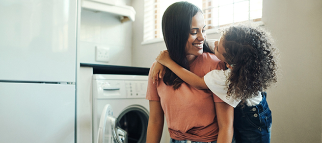 Daughter hugging mother